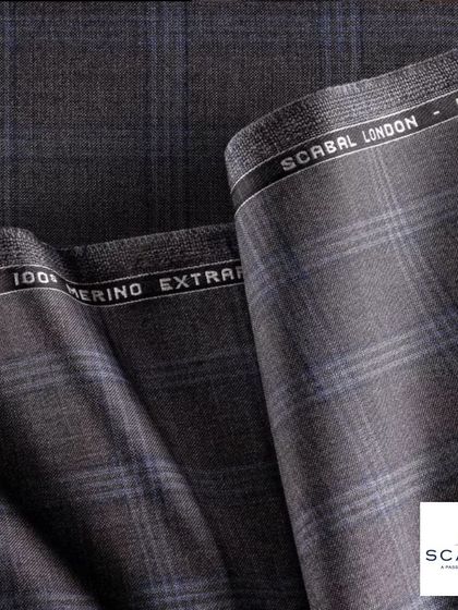 A luxurious Super 100's Merino Extrafine wool from Scabal. The texture and drape of fabrics like these are what make a bespoke suit truly exceptional.