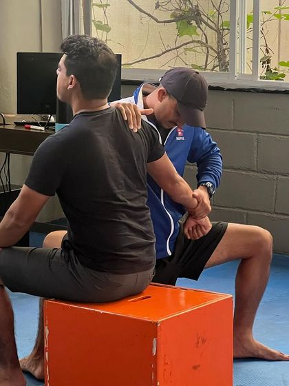 A hands-on approach to injury management. Our physio works on an athlete's shoulder joint to ensure proper function and address any potential issues before they become serious.