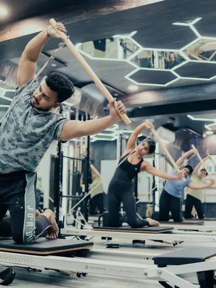 My classes welcome everyone, and I love seeing clients of all backgrounds discover the benefits of Pilates. This exercise on the Reformer uses the push-through bar to develop core stability, coordination, and upper body strength.