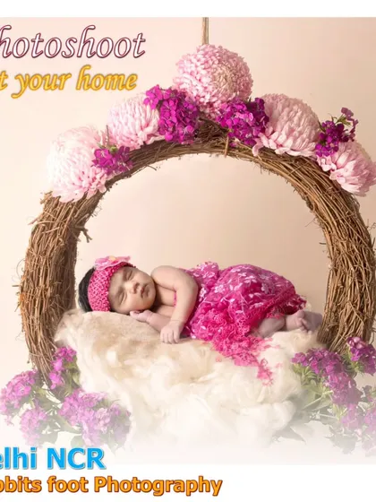 A baby in a floral hanging nest, used as a promotional image for my at-home photography.