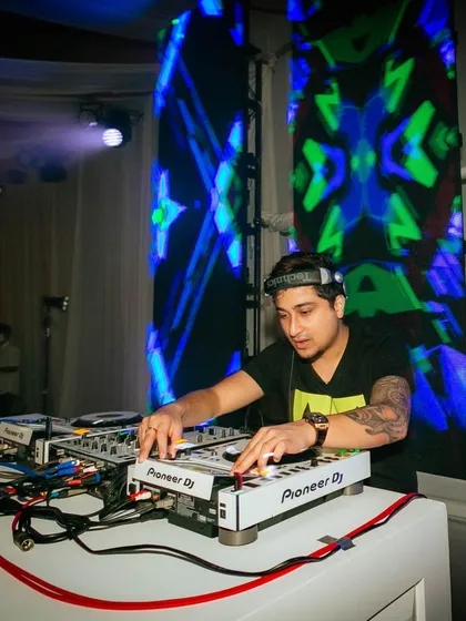 In the zone, mixing tracks at a beautiful destination wedding in Phuket. I ensure my setup is professional and fits perfectly with the event's decor.