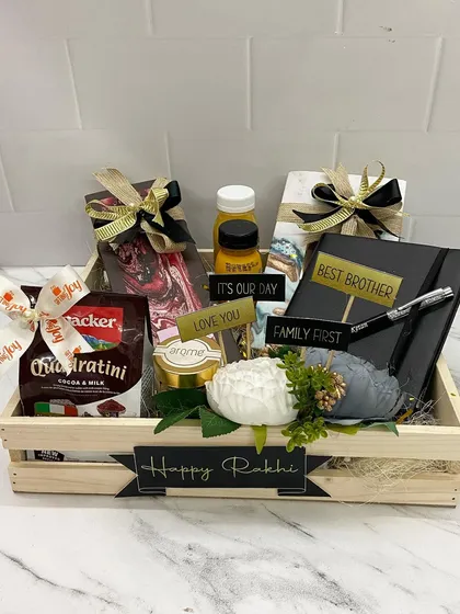 For the workaholic sibling, this crate combines sweet treats with customized stationery. It includes a 'Best Brother' diary and pen set, chocolates, and other goodies.
