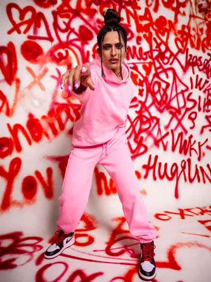A full-body shot from the graffiti set, showing how the custom background can cover the entire floor and wall for a completely immersive environment.