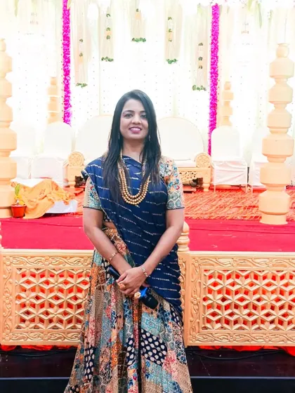 Ready to host another musical wedding, standing before the beautifully decorated mandap.