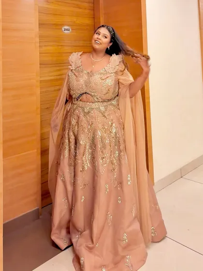 A candid moment of joy in the peach plus-size gown. It's moments like these that make my work so rewarding.