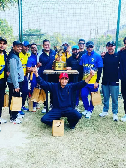 The winning team, Amigos Cricket Club, celebrating their victory in the Box Cricket League.