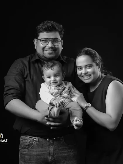A classic black and white family portrait that focuses purely on emotion and connection. This studio session captures the joy and love of a new family, creating a timeless piece of art for their home.