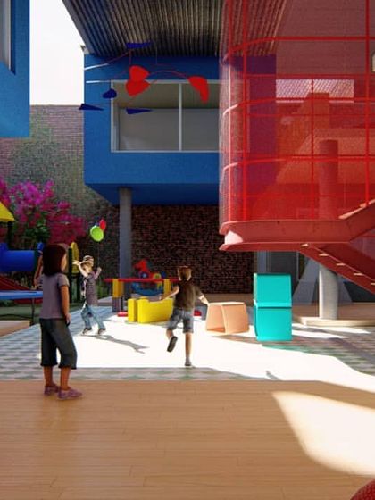 A rendering of the central play court in a kindergarten design. The space is designed to be interactive and engaging, with colorful, floating classroom volumes, a transparent red mesh staircase, and a variety of niches that encourage exploration and play.