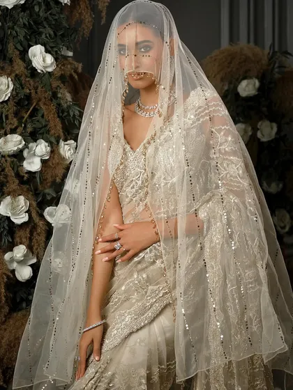 Another angle with the veil, creating a sense of anticipation and romance. The styling is soft, elegant, and timeless.