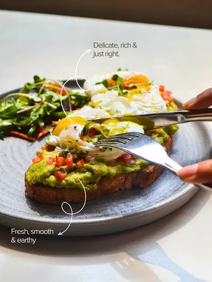 Avo craving answered. This shot highlights the delicate, rich poached egg and the fresh, earthy avocado mash on our signature toast.