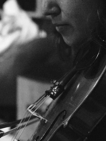 A close-up shot of the violin during rehearsal. This highlights the importance of melodic instruments in conversation with my vocals and flute.