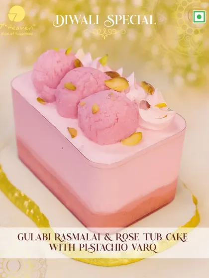 Our Gulabi Rasmalai & Rose Tub Cake is a Diwali delight. This dessert features layers of rose-infused cake and creamy rasmalai, topped with delicate pistachio varq.