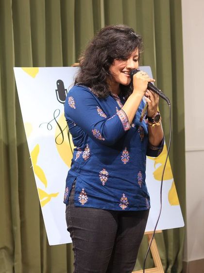 A singer lost in her song during a beautiful performance.