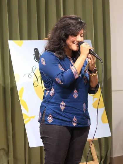 A singer lost in her song during a beautiful performance.