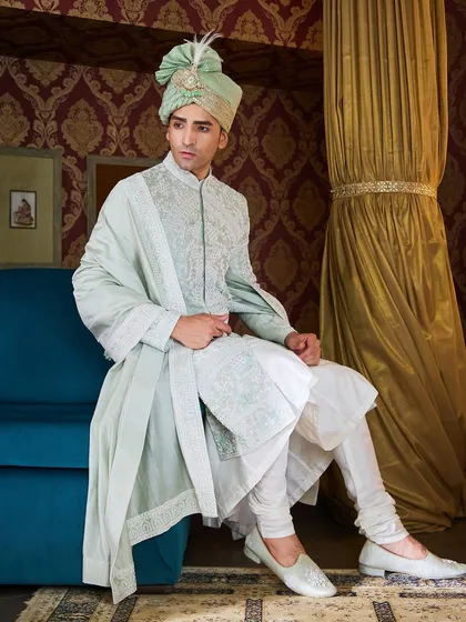 For a groom seeking a fresh and modern color palette, I designed this light green sherwani. The tonal embroidery creates a rich texture while maintaining a sophisticated, understated look.