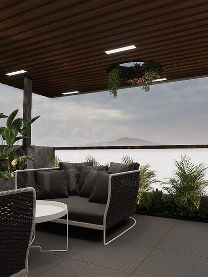 Another view of the seating area, showing the open-air design and the view from the terrace. The layout is designed to maximize both comfort and the sense of open space.