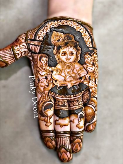 The mischievous Natkhat Kanha, captured in a detailed mehndi portrait. This design, showing little Krishna with his hand in a pot of butter, brings blessings and smiles.