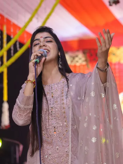 Lost in the divine melody during a performance. This is the state of bliss I aim to create for my audience during devotional events.