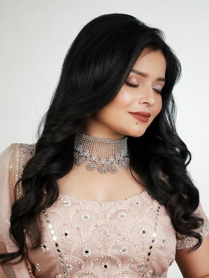 A soft, elegant party look with a mirror-work lehenga. You will learn to create makeup that complements detailed and reflective outfits.