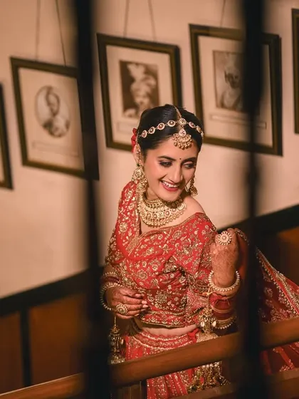 A happy, candid shot of the bride on the staircase of the historic Woodville Palace. Her natural smile makes this portrait feel warm and genuine.
