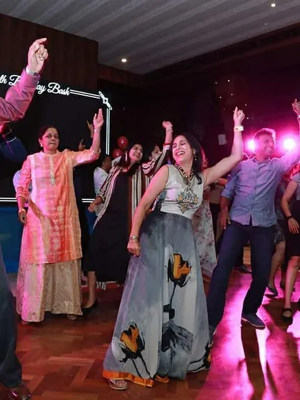Who says you can't have a flash mob for a 50th birthday? This picture captures the surprise and absolute delight of a birthday bash where friends and family jumped in for a choreographed routine. It proves my point that anyone, at any age, can dance.
