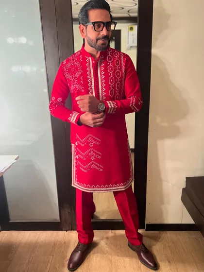 A classic red bandhani-inspired kurta for a Navratri night. The color is powerful, and the traditional print is perfect for the occasion.