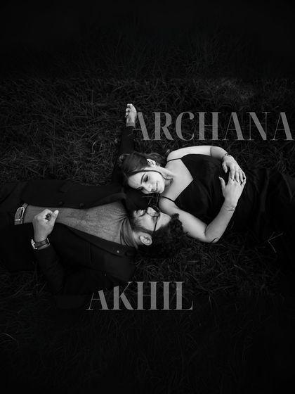 A dramatic black and white overhead shot of a couple lying in the grass. The strong contrast and composition make this a powerful and artistic pre-wedding portrait.