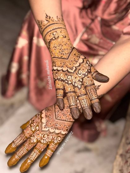 A beautiful semi-bridal design with a focus on wrist and finger details, leaving the palm more open.