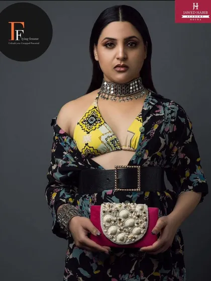 A high fashion look from a professional shoot, featuring bold styling and accessories, with makeup and hair by our academy students.