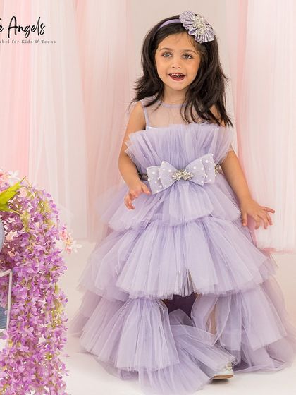 A full front view of the tiered lilac gown, a fun and fashionable choice for any party.