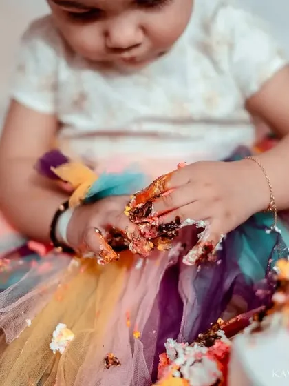 A close-up of the messy hands and colorful aftermath. These detail shots are a fun way to remember just how much enjoyment came from that one little cake.