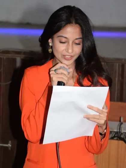 Clear, constructive, and encouraging feedback is a core part of our judging philosophy. Here I am on the mic at St. Anne's, sharing our thoughts with the performers and the audience, ensuring everyone feels seen and celebrated.