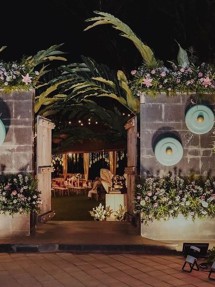 Another shot of the reception entrance, showing the beautiful stonework and the abundance of flowers. The design was meant to feel like entering a magical, hidden garden.