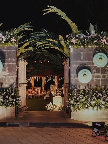 The grand entrance to Bhumi and Avi's wedding reception. We designed a stunning floral-adorned gateway to welcome guests into an evening of elegance and celebration.