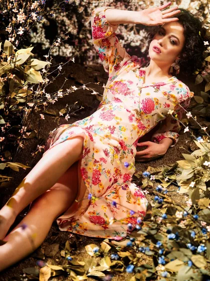 A dreamy, floral meadow created with projection and enhanced with real foliage in the foreground. This layering technique creates a rich, immersive, and three-dimensional effect.