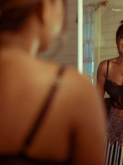 A happy, spontaneous moment captured in the mirror. These shots add a lot of life and energy to a gallery.