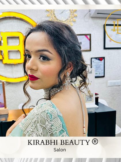 A side profile of this elegant party look. It shows off the soft curls in her hair and the beautifully blended eye makeup.