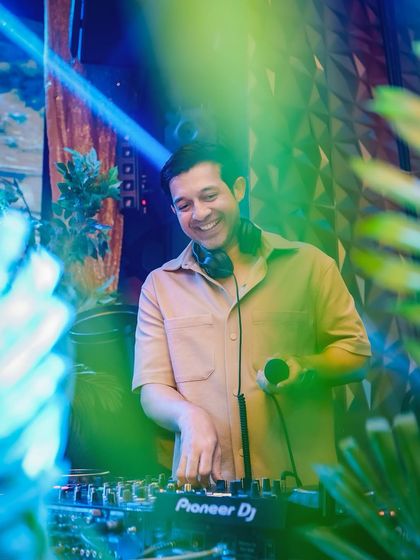 A candid shot of me enjoying the music while mixing. My passion for music is what drives the energy of the entire night.