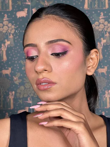 A close-up of the pink eyeshadow. The colors are blended seamlessly from a light shimmer to a deeper pink in the crease, creating beautiful dimension.