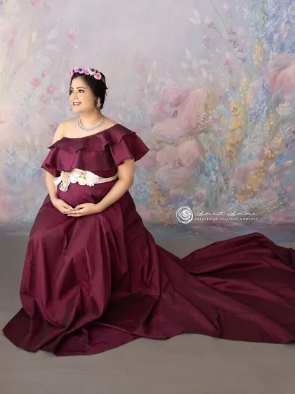 Seated gracefully, this pose allows the magnificent train of the gown to become a key part of the composition, creating a beautiful, artistic portrait.