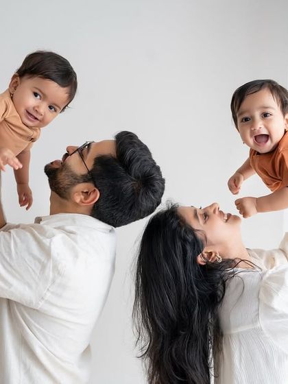 A playful family portrait with twin boys.