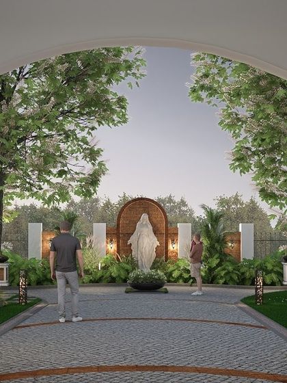 The front yard of the Nilaya Residence radiates a mix of regional charm and colonial beauty. A terracotta-accented cobblestone pathway guides the eye towards a Mother Mary statue, creating a calm focal point.