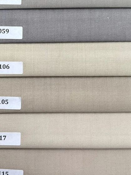 A selection of neutral shades, from light grey to beige. These versatile colors are perfect for creating foundational pieces like trousers and blazers.
