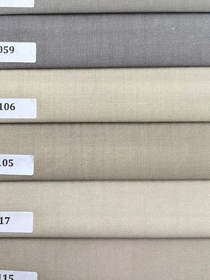 A selection of neutral shades, from light grey to beige. These versatile colors are perfect for creating foundational pieces like trousers and blazers.