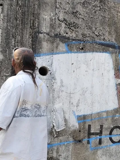 A shot of me looking at the wall before starting a piece. Every wall presents a new challenge and a new opportunity.