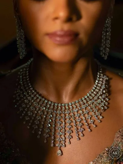 A close-up of a bespoke bridal masterpiece, where every diamond is meticulously set to create a river of light. This 69-carat diamond necklace showcases the pinnacle of our handcrafted bridal designs, created to feel as magnificent as it looks and move with the grace of the bride who wears it.
