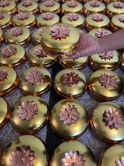A closer look at the stunning copper and gold lotus boxes that were part of the Arangetram hampers. These are a perfect example of traditional, elegant gifting.