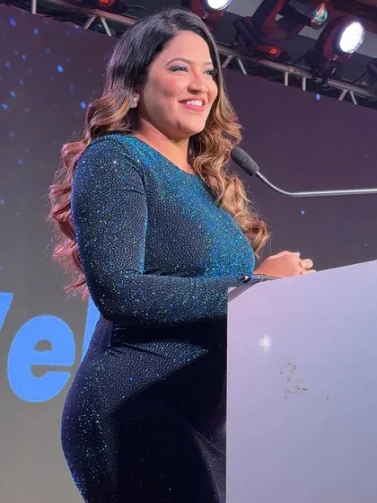 A close-up shot from the Waaree event, showing the sparkle of my dress and my smile.