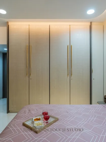 A view of the room showing the spacious layout and the cohesive design. The soft color palette and warm lighting make it a perfect retreat for relaxation.