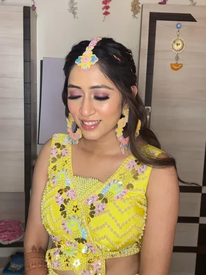 Another angle of this vibrant Haldi look, with the bride's happy smile.
